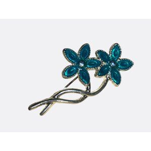 Silver Tone Flower Brooch With Blue Enamel Petals and Rhinestone Accents